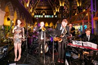 Wedding party band performing swing and soul music at Oxford University Museum of Natural History. Photography by Daniel West.