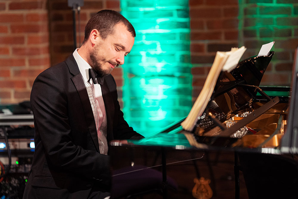 Alex Howgego (piano) performing with the Down for the Count Orchestra at Turner Sims, Southampton