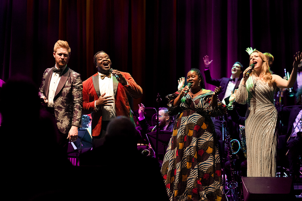 Vocalists Callum Gillies, Marvin Muoneké, Ineza and Lydia Bell performing with The Down for the Count Orchestra at The Queen's Hall, Edinburgh