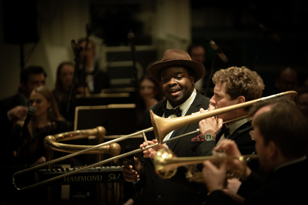 Marvin Muoneké (vocals) and Ed Parr (trombone) performing with the Down for the Count Orchestra at The Albert Hall, Nottingham