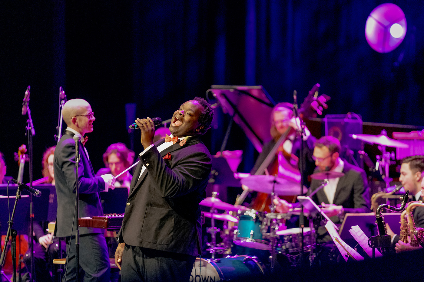Vocalist Marvin Muoneké performing with The Down for the Count Swing Orchestra conducted by Mike Paul-Smith