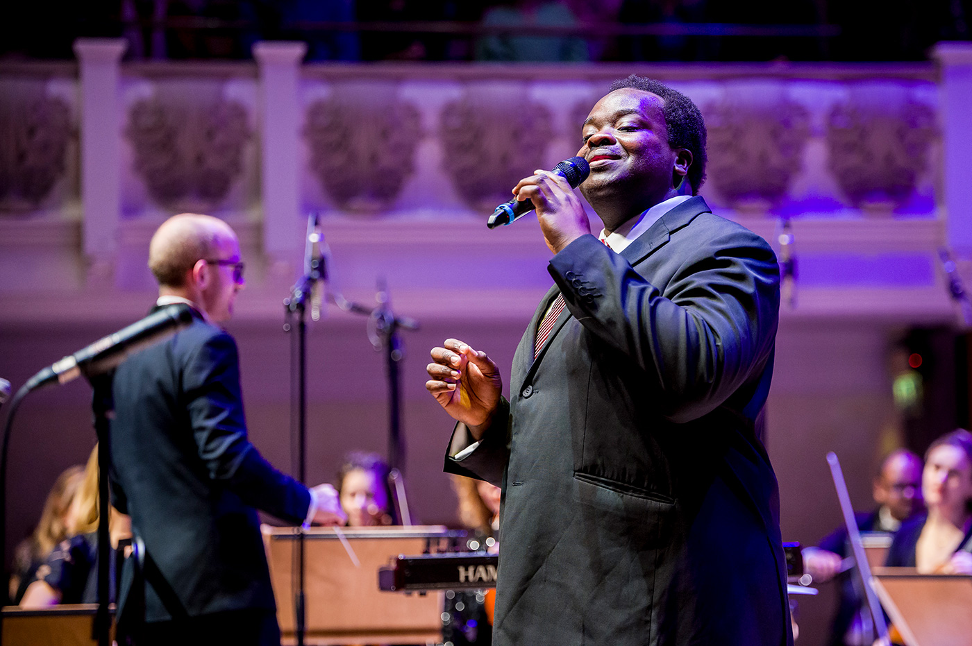 Vocalist Marvin Muoneké performing with The Down for the Count Swing Orchestra conducted by Mike Paul-Smith at Cadogan Hall, London