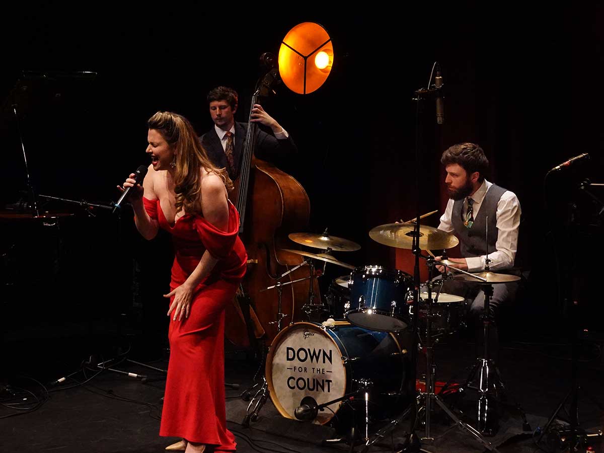 Vocalist Katie Birtill and bassist James Owston performing with the Down for the Count All-Stars