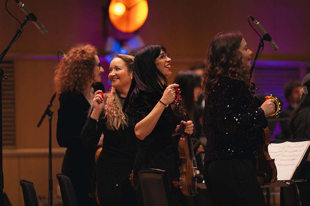 Mónica Viñoly (violin) performing with Down for the Count Swing Orchestra
