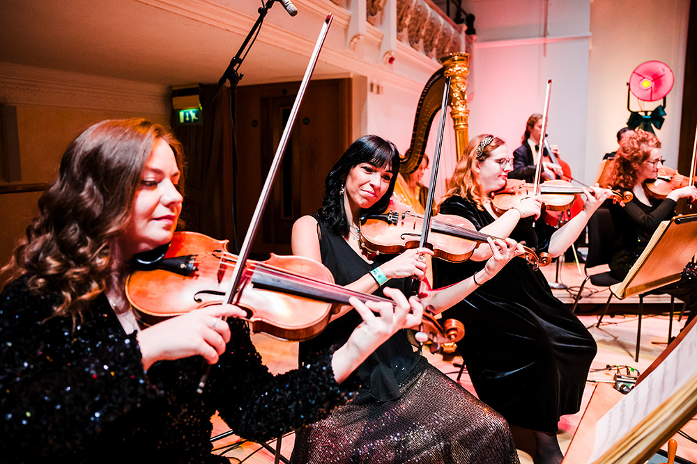 Monica Vinoly playing violin with Down for the Count Swing Orchestra