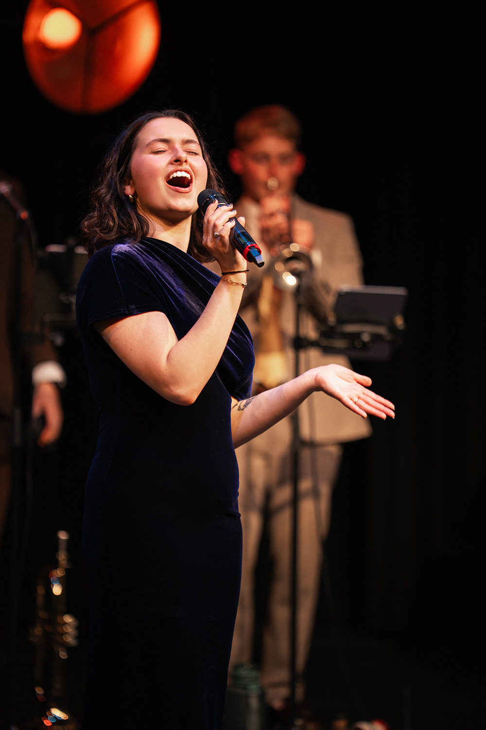 Vocalist Grace Sheene performing with Down for the Count