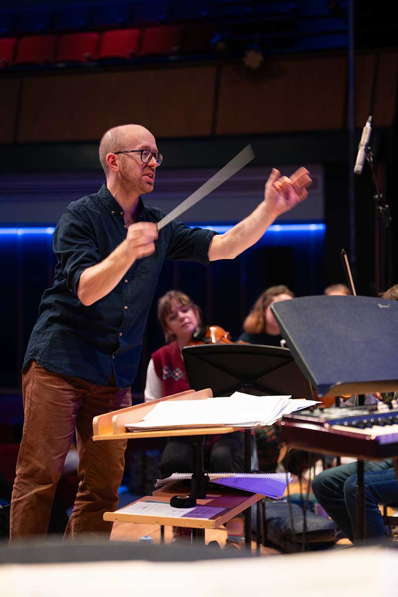 Down for the Count's conductor Mike Paul-Smith delivering an educational student workshop at Northampton School for Boys